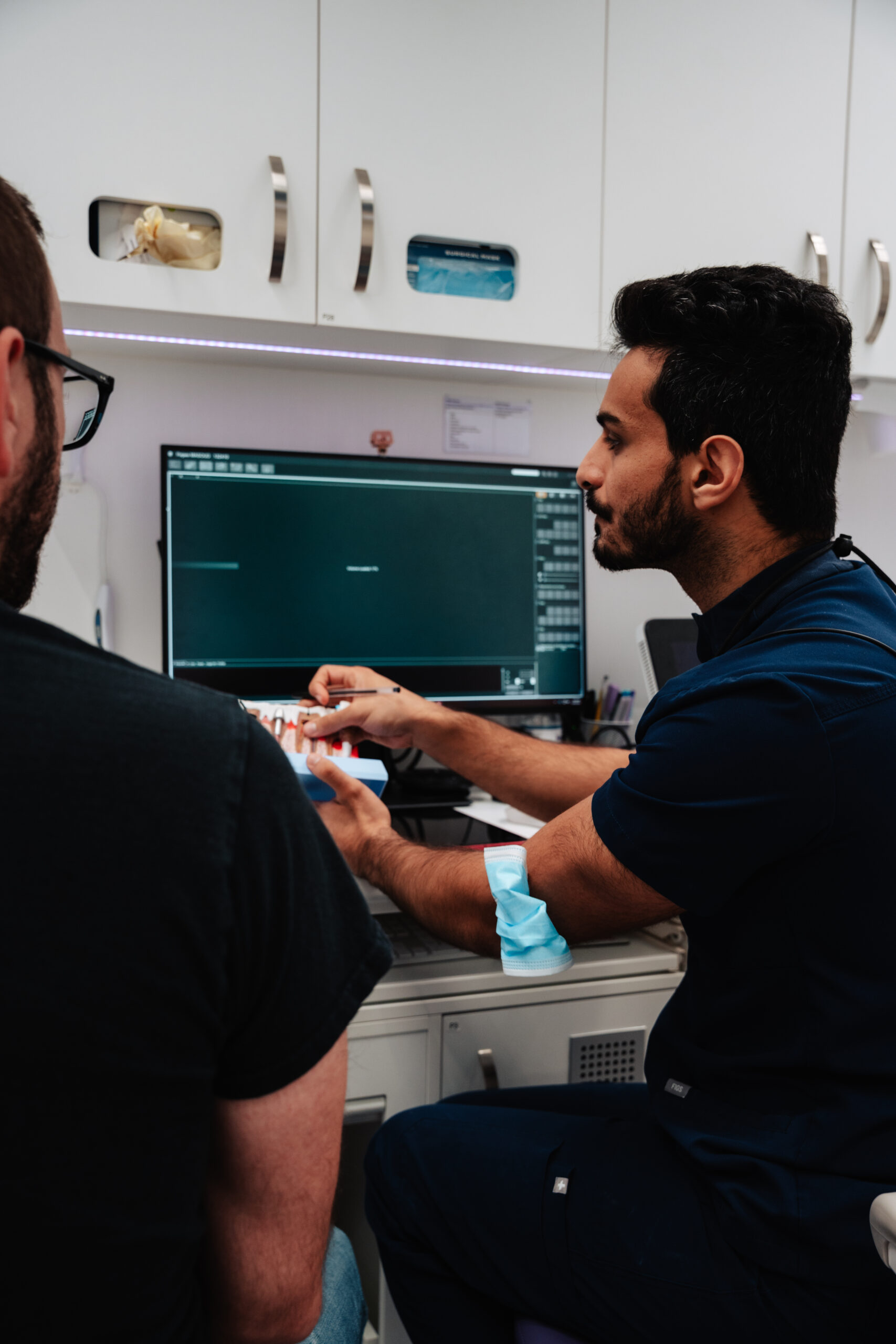 dentist explaining the procedure to a patient