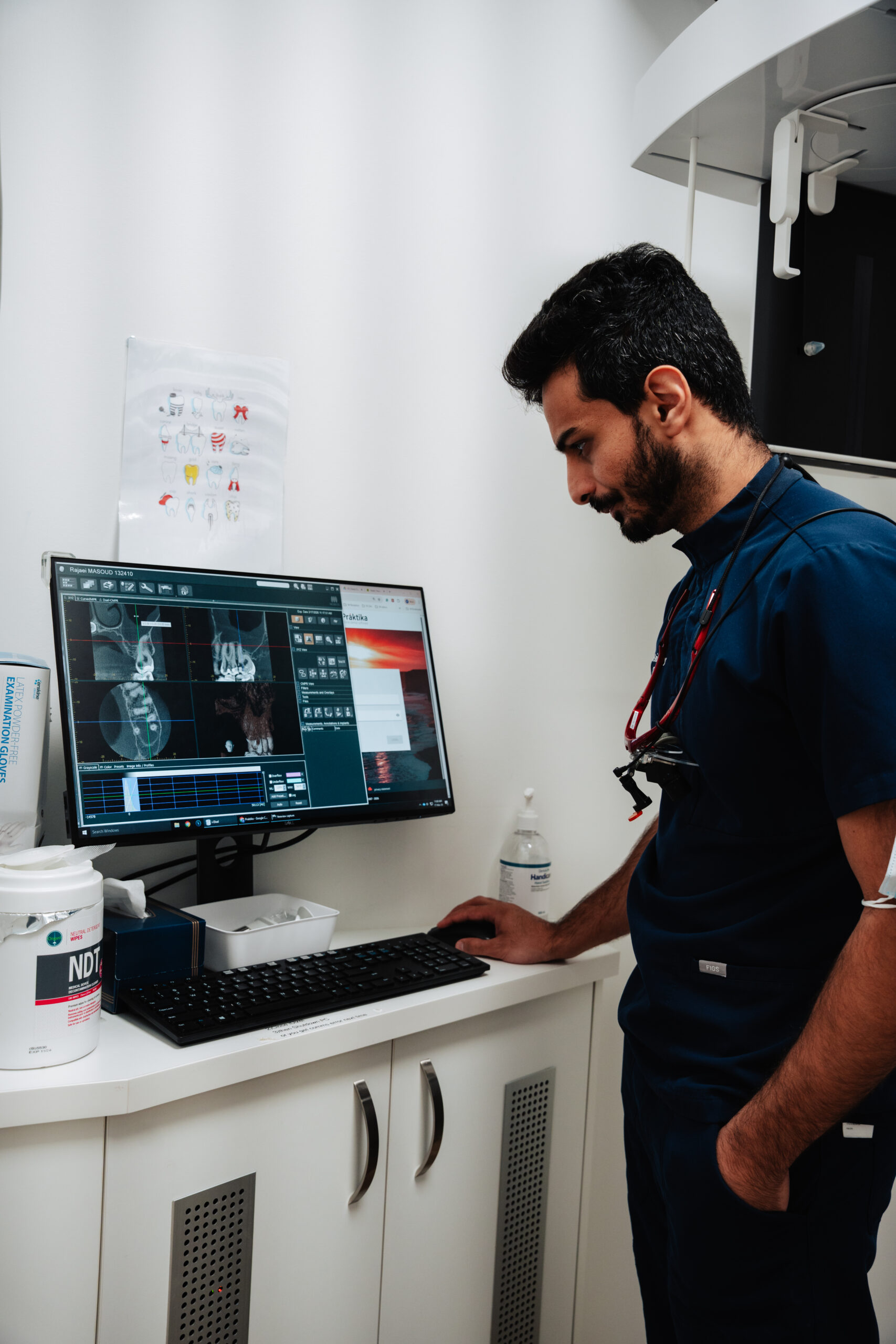 Dentist reviewing a 3D dental CBCT scan before treatment planning