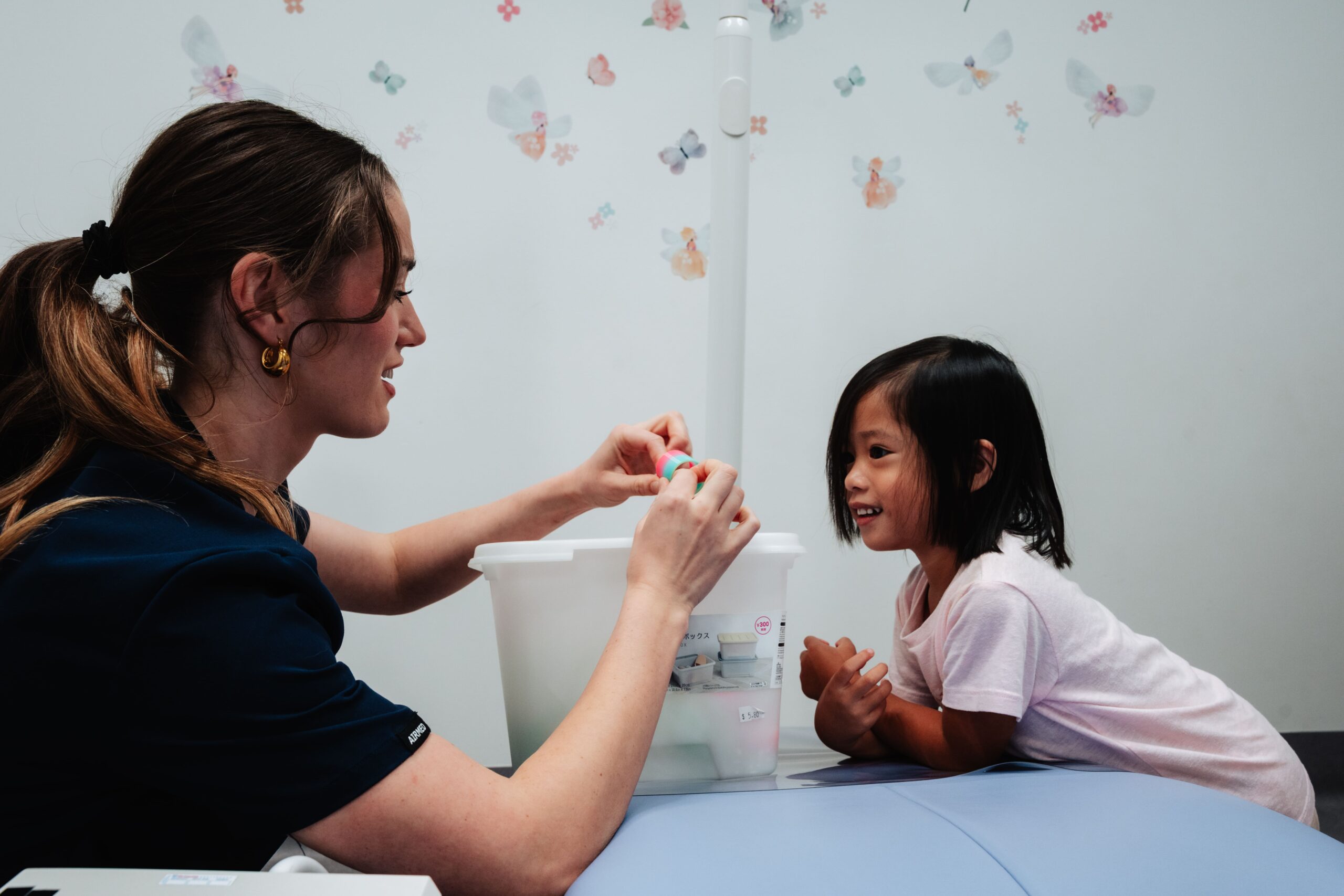 a receptionist entertaining a little child